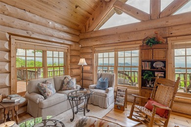 Perched atop over 12 secluded acres, this majestic log cabin - photo 22