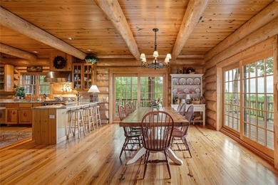 Perched atop over 12 secluded acres, this majestic log cabin - photo 23