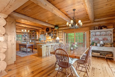 Perched atop over 12 secluded acres, this majestic log cabin - photo 24
