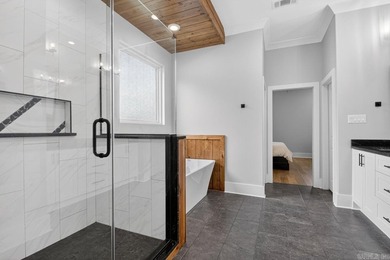 Experience contemporary living in this stunning custom-built - photo 25