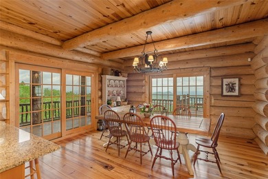 Perched atop over 12 secluded acres, this majestic log cabin - photo 25