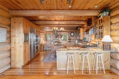 Perched atop over 12 secluded acres, this majestic log cabin - photo 27