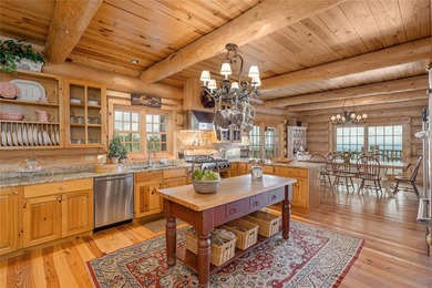 Perched atop over 12 secluded acres, this majestic log cabin - photo 30