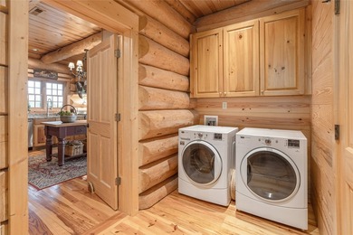 Perched atop over 12 secluded acres, this majestic log cabin - photo 33