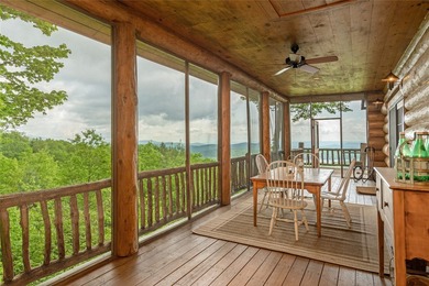 Perched atop over 12 secluded acres, this majestic log cabin - photo 35