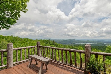 Perched atop over 12 secluded acres, this majestic log cabin - photo 36