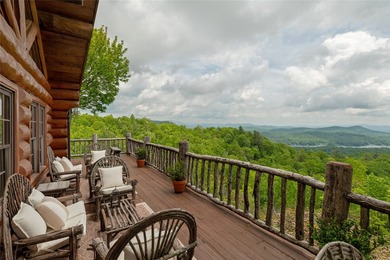 Perched atop over 12 secluded acres, this majestic log cabin - photo 44