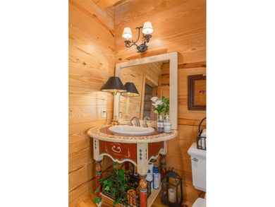 Perched atop over 12 secluded acres, this majestic log cabin - photo 47