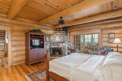 Perched atop over 12 secluded acres, this majestic log cabin - photo 50