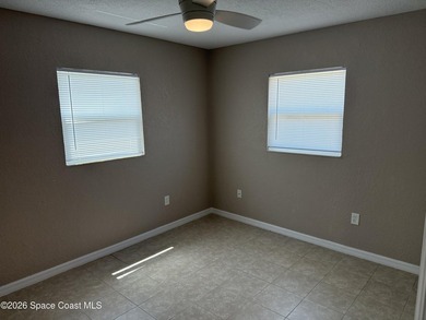 Step inside to find tile flooring flowing throughout the main - photo 11