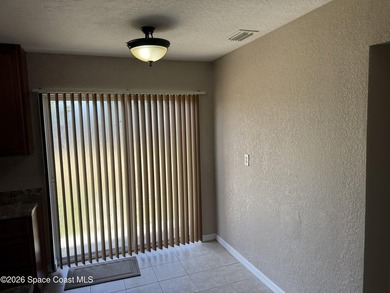 Step inside to find tile flooring flowing throughout the main - photo 12