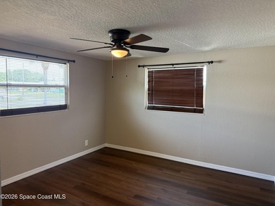 Step inside to find tile flooring flowing throughout the main - photo 15