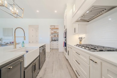 Welcome to elevated living in this stunning custom-built home - photo 11