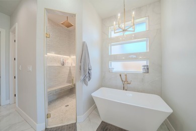 Welcome to elevated living in this stunning custom-built home - photo 19