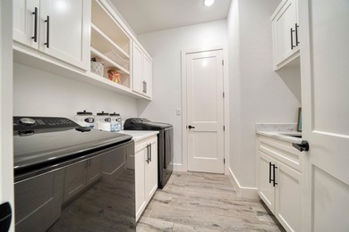 Welcome to elevated living in this stunning custom-built home - photo 30
