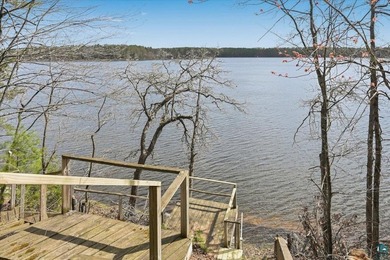 Discover this inviting 4-bedroom, 1-bath home on 3.26 wooded - photo 3