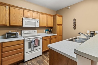 Welcome home to this bright and airy 55+ condominium in the - photo 2