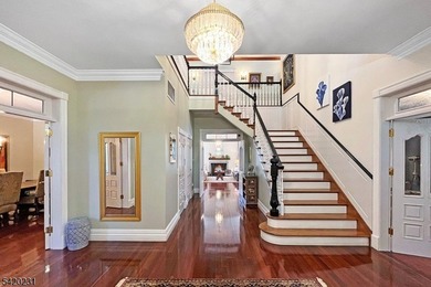 This stately, European-style brick home with striking - photo 3