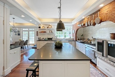 This stately, European-style brick home with striking - photo 5