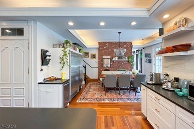 This stately, European-style brick home with striking - photo 6