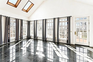 This stately, European-style brick home with striking - photo 9