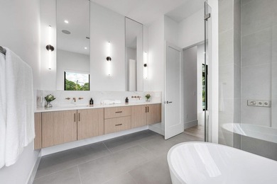 This two-story residence features five bedrooms, six and a half - photo 5