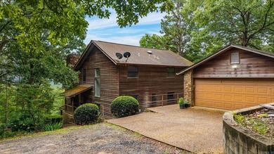 Nestled on 5 private wooded acres, this custom log home offers - photo 2