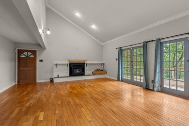 Nestled on 5 private wooded acres, this custom log home offers - photo 4