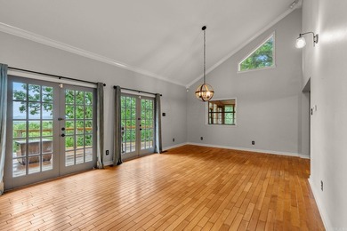 Nestled on 5 private wooded acres, this custom log home offers - photo 6