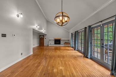 Nestled on 5 private wooded acres, this custom log home offers - photo 7