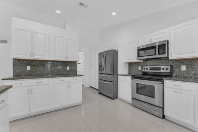 This stunning 4-bedroom, 2-bath pool home in the heart of Coral - photo 16