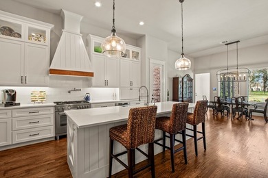 Stunning 4-bedroom, 3-bath modern farmhouse in the gated