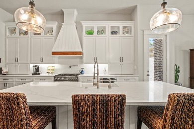 Stunning 4-bedroom, 3-bath modern farmhouse in the gated