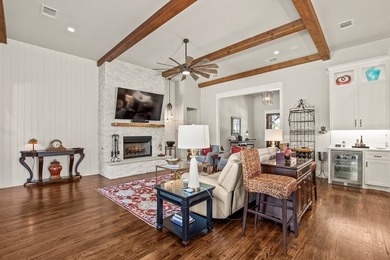 Stunning 4-bedroom, 3-bath modern farmhouse in the gated