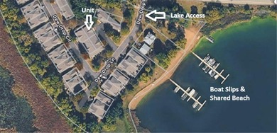 Very well cared for one-level townhome with lake access AND boat