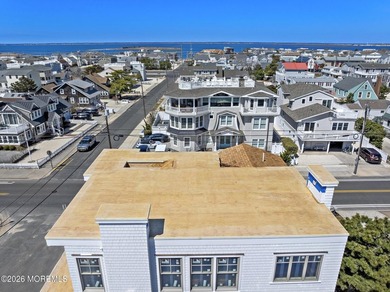 Just one home off the beach, this stunning new construction in - photo 12