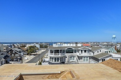 Just one home off the beach, this stunning new construction in - photo 22