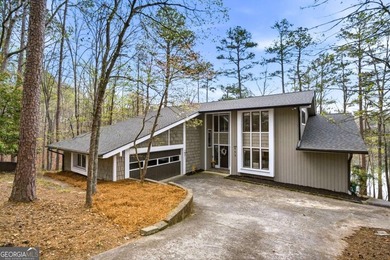 Tucked away on a quiet cove in the highly sought after Lake - photo 1