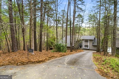 Tucked away on a quiet cove in the highly sought after Lake - photo 3