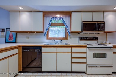 Attractive 3BR 2Bth cedar sided lakefront ranch offers stunning - photo 17