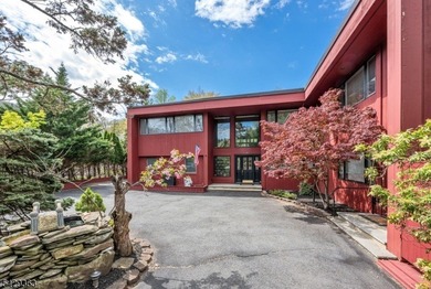 Set on a private and beautifully landscaped .8-acre property - photo 2
