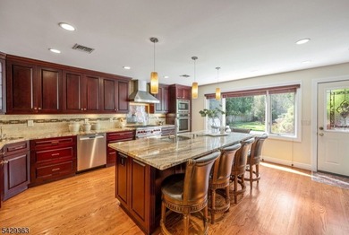 Set on a private and beautifully landscaped .8-acre property - photo 9