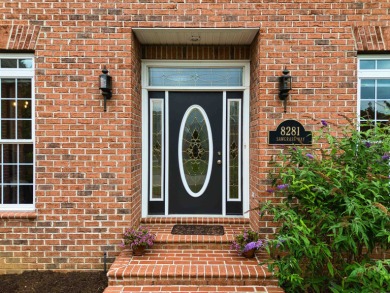 This Stately, all brick colonial is situated on over 1/2 acre