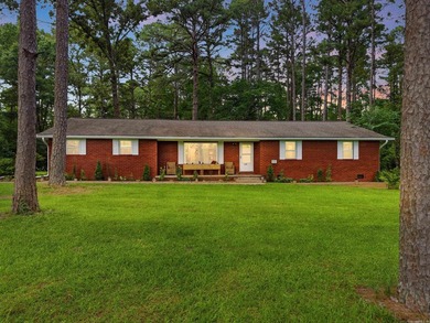 Welcome to this beautifully updated all-brick home nestled in a - photo 1