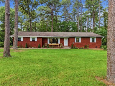 Welcome to this beautifully updated all-brick home nestled in a - photo 3