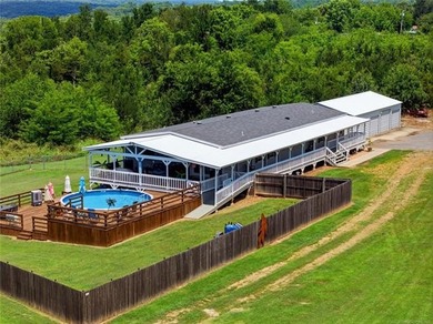 VA-approved and just 2 miles from Lake Tenkiller! This spacious - photo 1