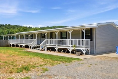 VA-approved and just 2 miles from Lake Tenkiller! This spacious - photo 8