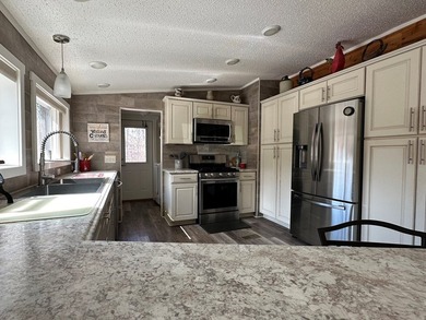 REDUCED!!! Experience ultimate lakeside living on 952 feet of - photo 16