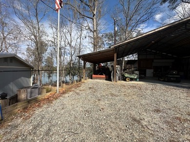 REDUCED!!! Experience ultimate lakeside living on 952 feet of - photo 33