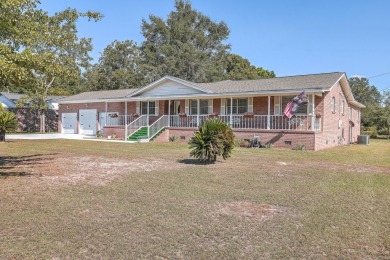 Lake Home For Sale in Saint Stephen, South Carolina